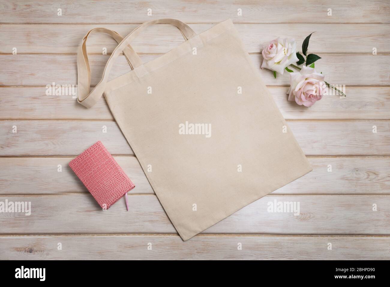 Download Canvas Tote Bag Mockup With Pink Notepad And Two Roses Empty Tote Bag Mock Up For Branding Presentation Stock Photo Alamy PSD Mockup Templates