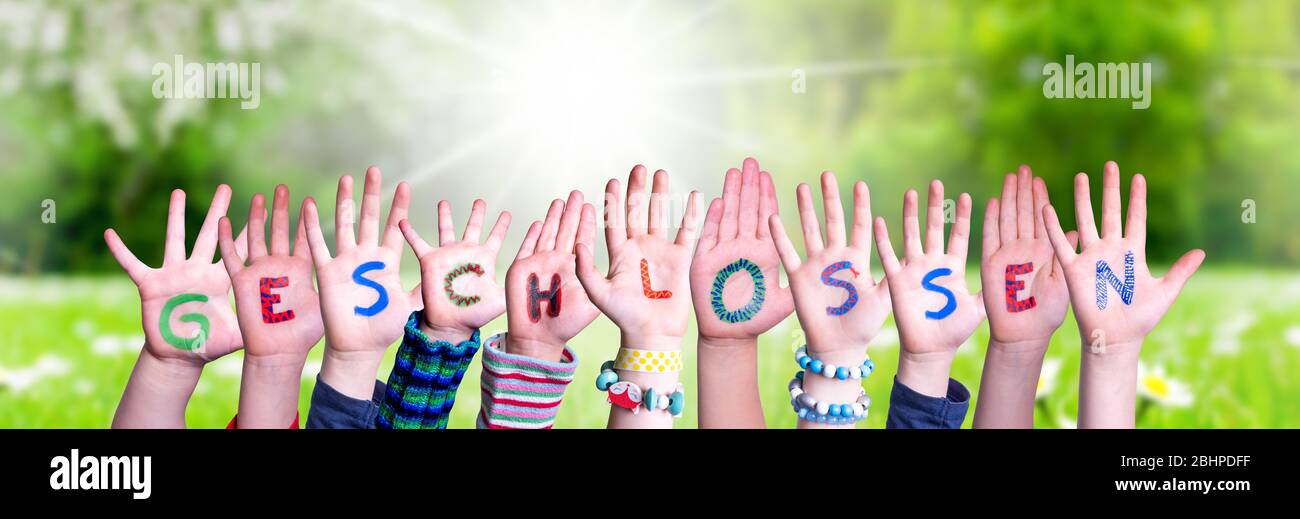 Children Hands Building Word Geschlossen Means Closed, Grass Meadow Stock Photo
