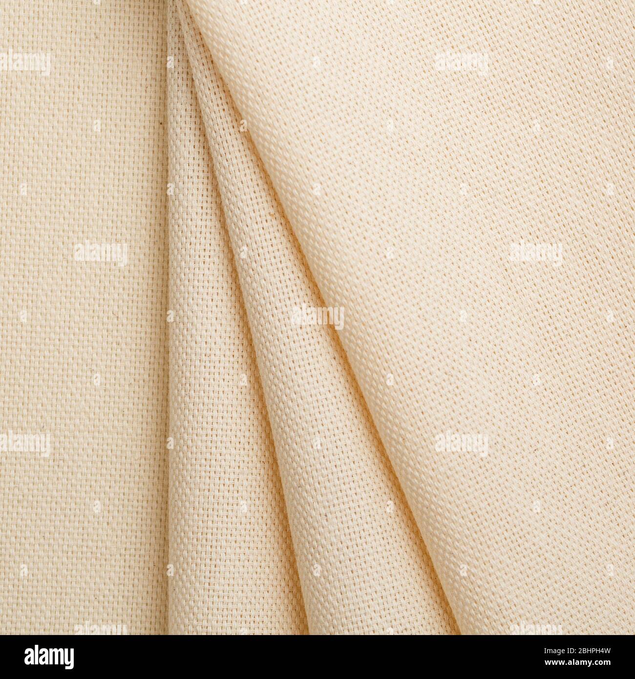 Cotton fabric in light yellow color for arts painting backdrop, sacking and bagging design Stock Photo