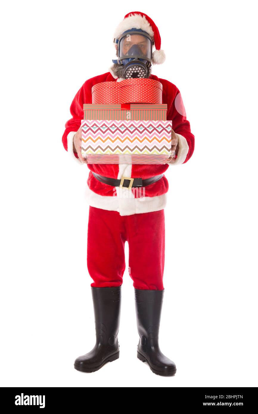 Santa wearing protective gear against coronavirus, sad Christmas concept. Stock Photo