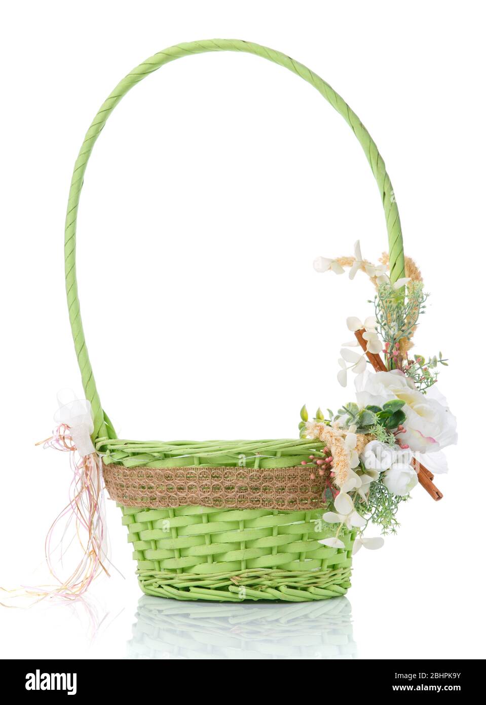 Wicker basket decorated with flowers on white background Stock Photo ...