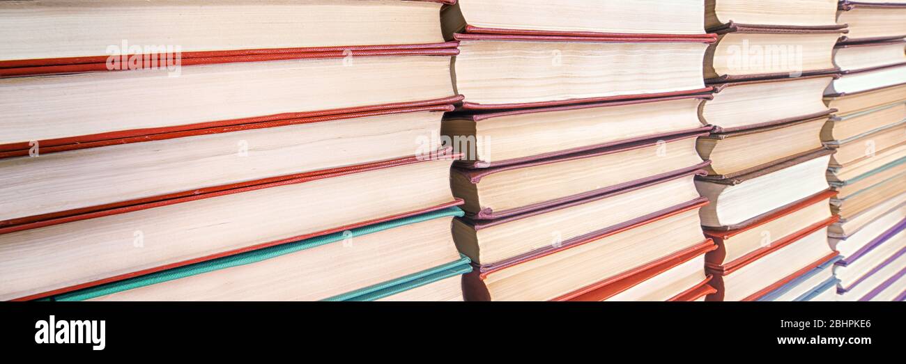Books pile diminishing perspective view. Selective focus Stock Photo