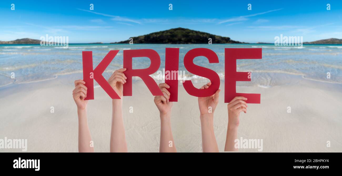 People Hands Holding Word Krise Means Crisis, Ocean Background Stock Photo