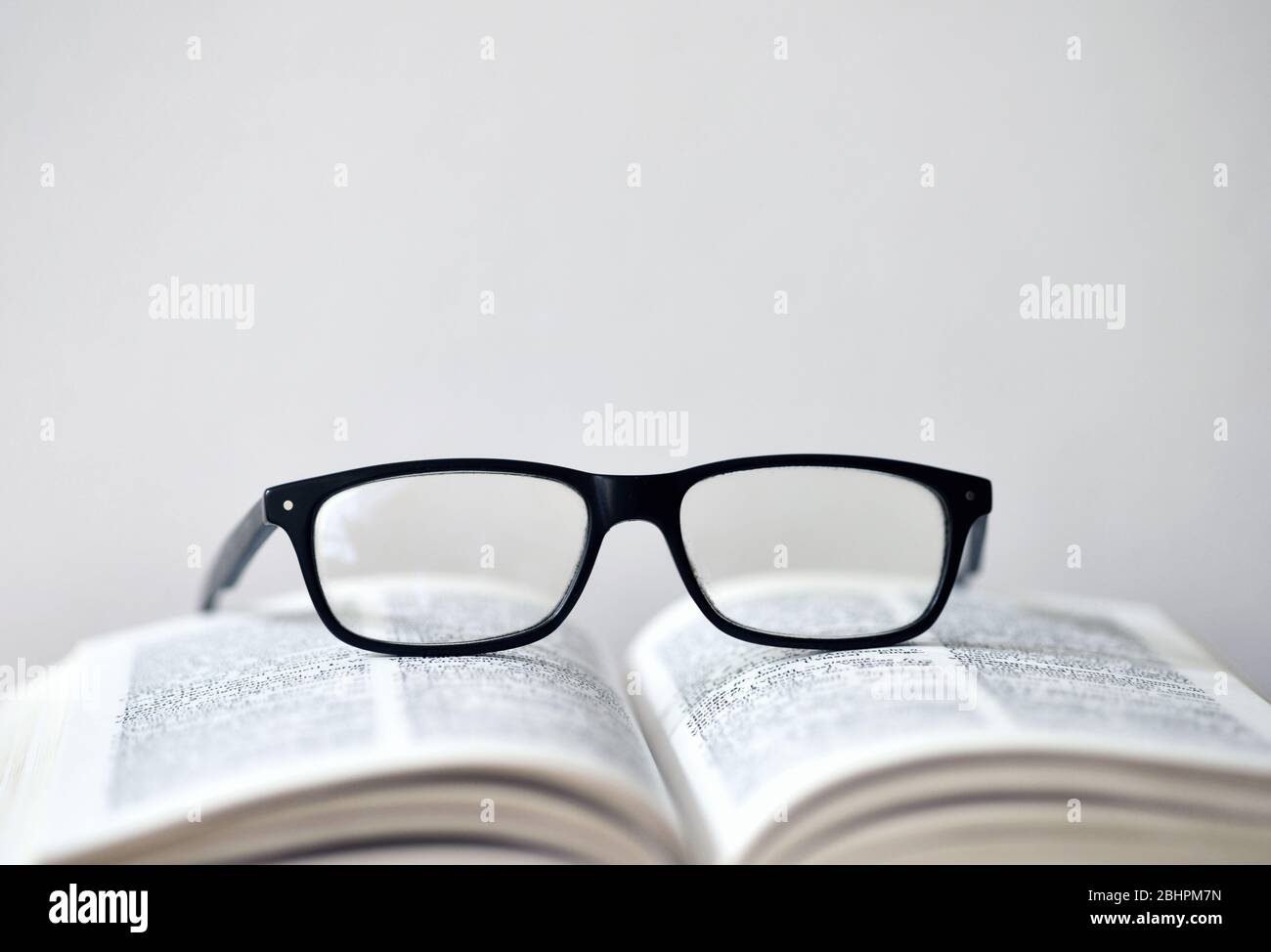 Eyeglasses on a translation book Stock Photo