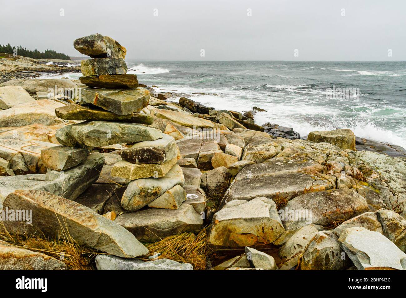 Cairn on shoreline near White Point, Nova Scotia, Canada Stock Photo