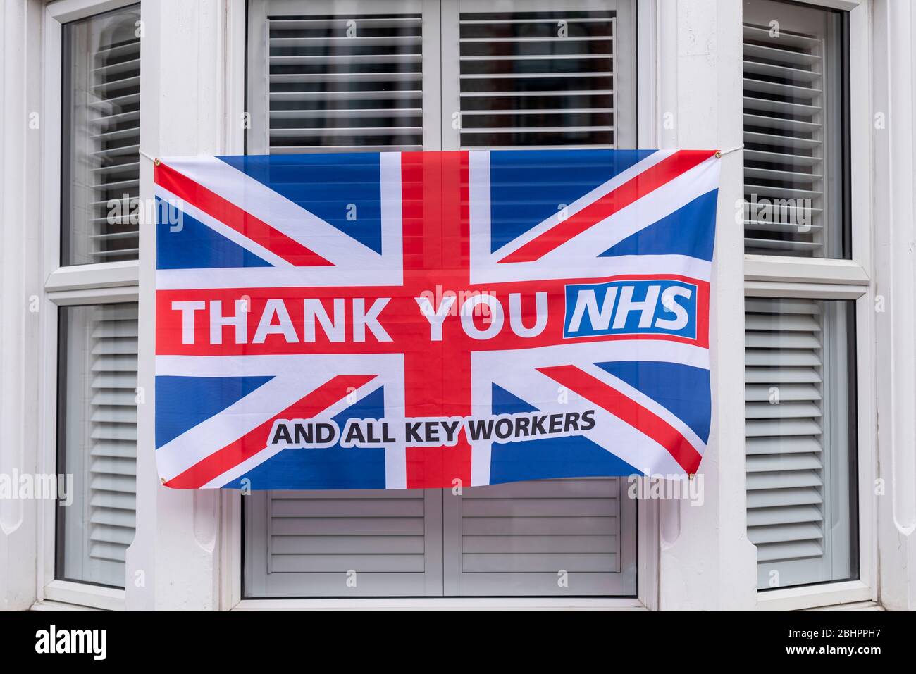 British Union Jack flag with thank you NHS and key workers message during the COVID-19 Coronavirus pandemic outbreak period Southend on Sea, Essex, UK Stock Photo
