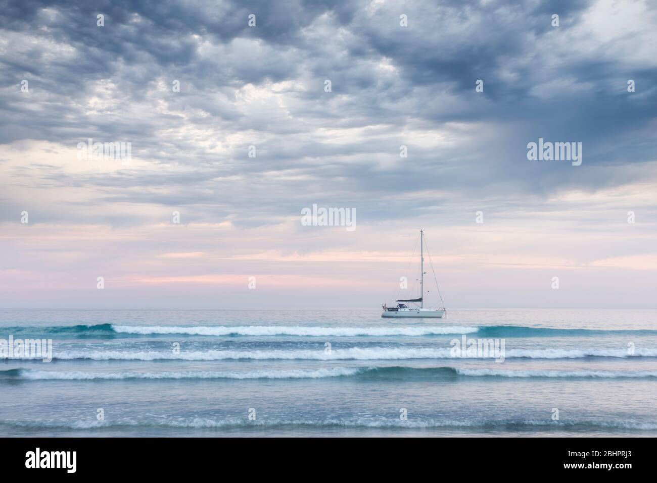 Summer storm clouds gather above Sennen Cove creating an unusual cloudscape across the bay. Stock Photo