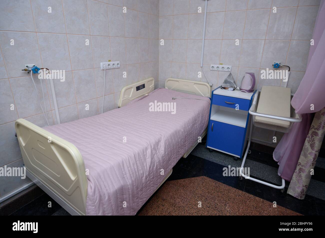 Maternity ward for delivery like at home, hospital bed, furniture at maternity hospital Stock Photo
