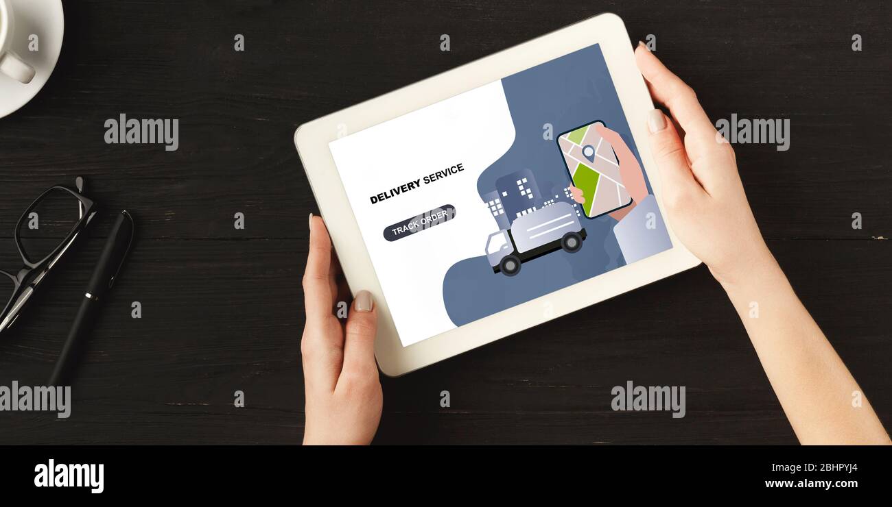 Woman holds tablet with online delivery service, panorama Stock Photo ...