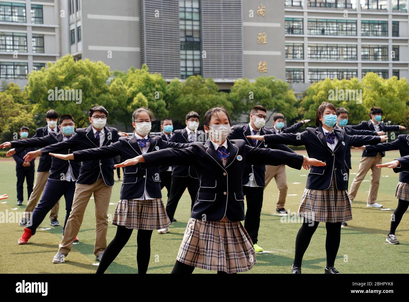 Shanghai. 27th Apr, 2020. Students of grade 12 do physical exercise at the No. 1 High School Affiliated to East China Normal University in east China's Shanghai, April 27, 2020. Senior students in junior and senior high schools in Shanghai resumed classes on Monday. Credit: Liu Ying/Xinhua/Alamy Live News Stock Photo