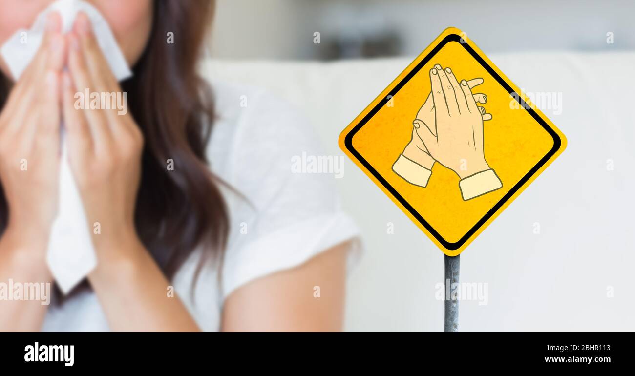 Illustration of hand washing with a sick woman blowing her nose in the background. Stock Photo