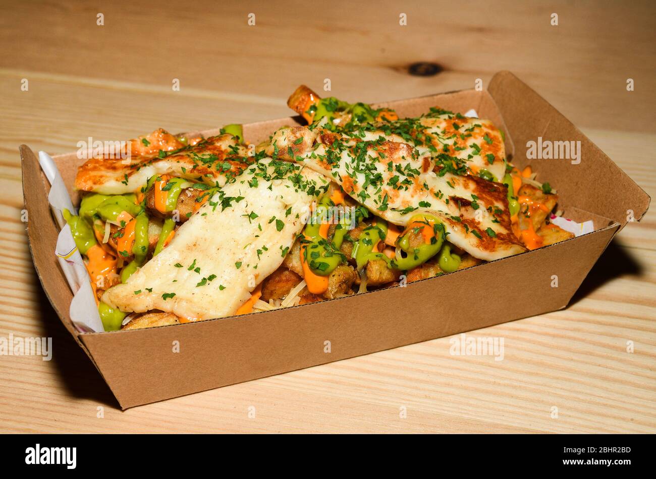 Disco french fries, gravy sauce mozzarella halloumi cheese potatoes, poutine dish. Cheese fries