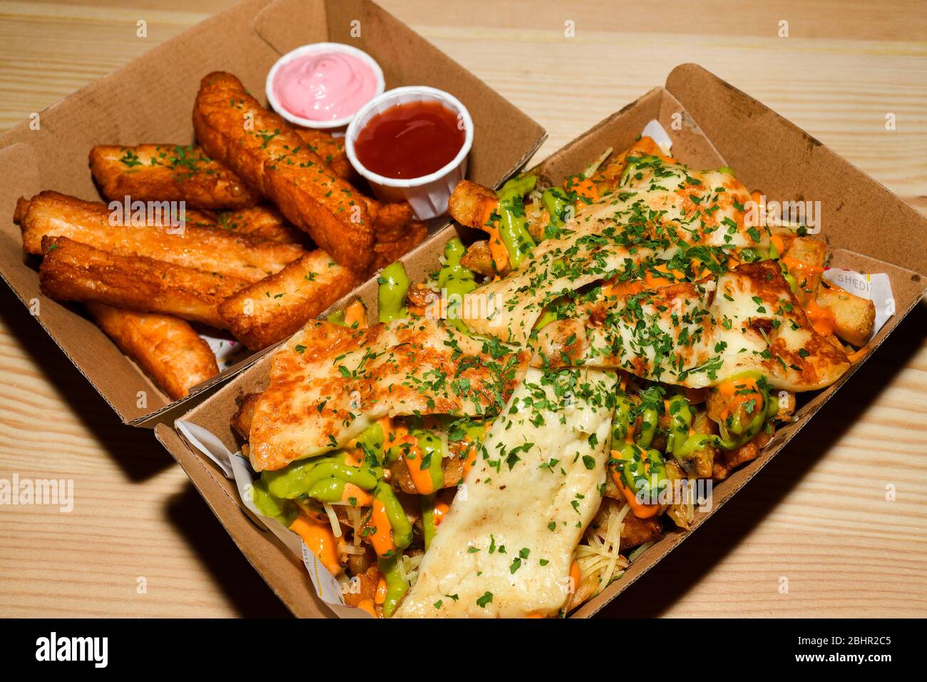 Disco french fries, gravy sauce mozzarella halloumi cheese potatoes, poutine dish. Cheese fries