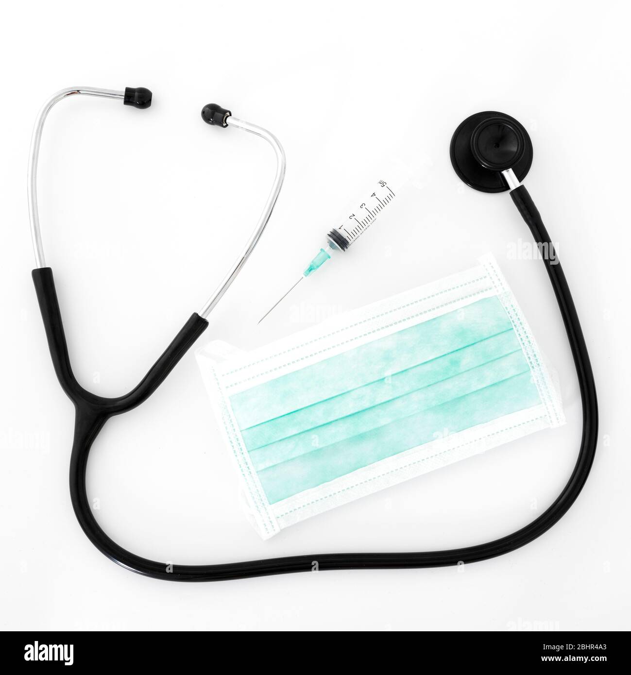 Stethoscope, syringe and mask on white background Stock Photo - Alamy