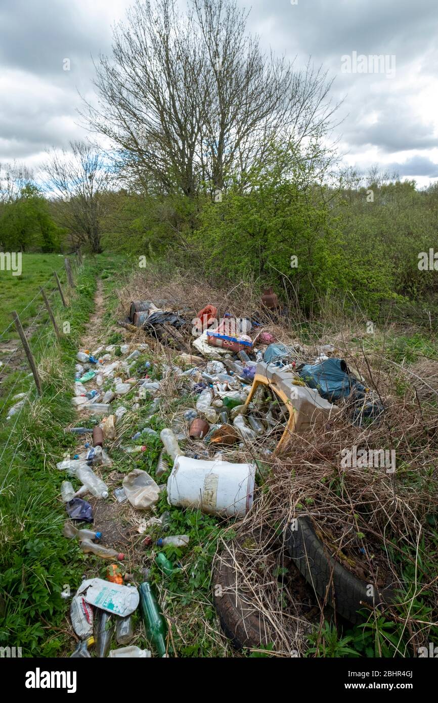 Fly tipping on the banks of the River Almond, West Lothian Scotland. Stock Photo