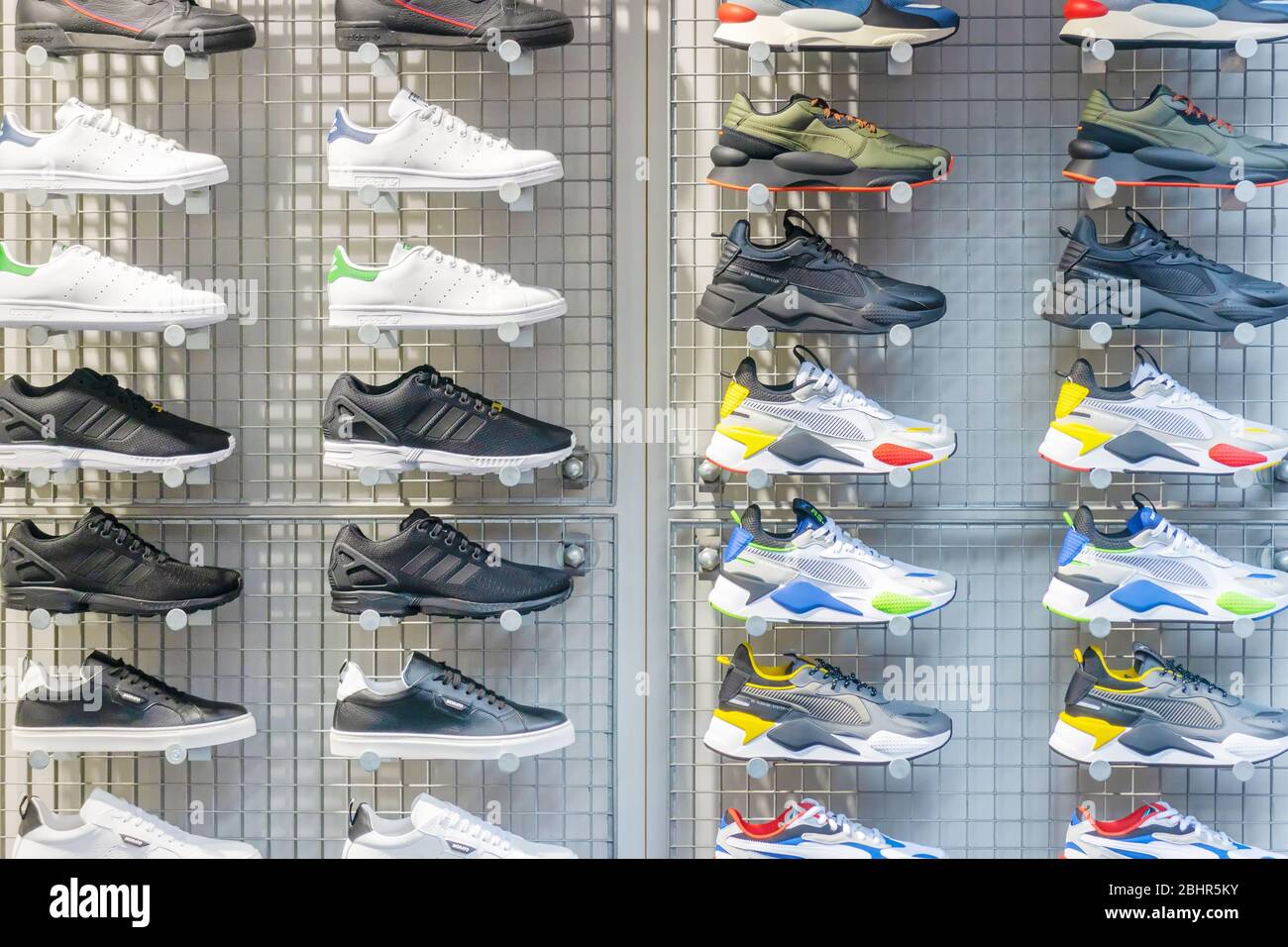Leiden, The Netherlands - January 16, 2020: Display of different sports shoes in a store window in Leiden, The Netherlands Stock Photo