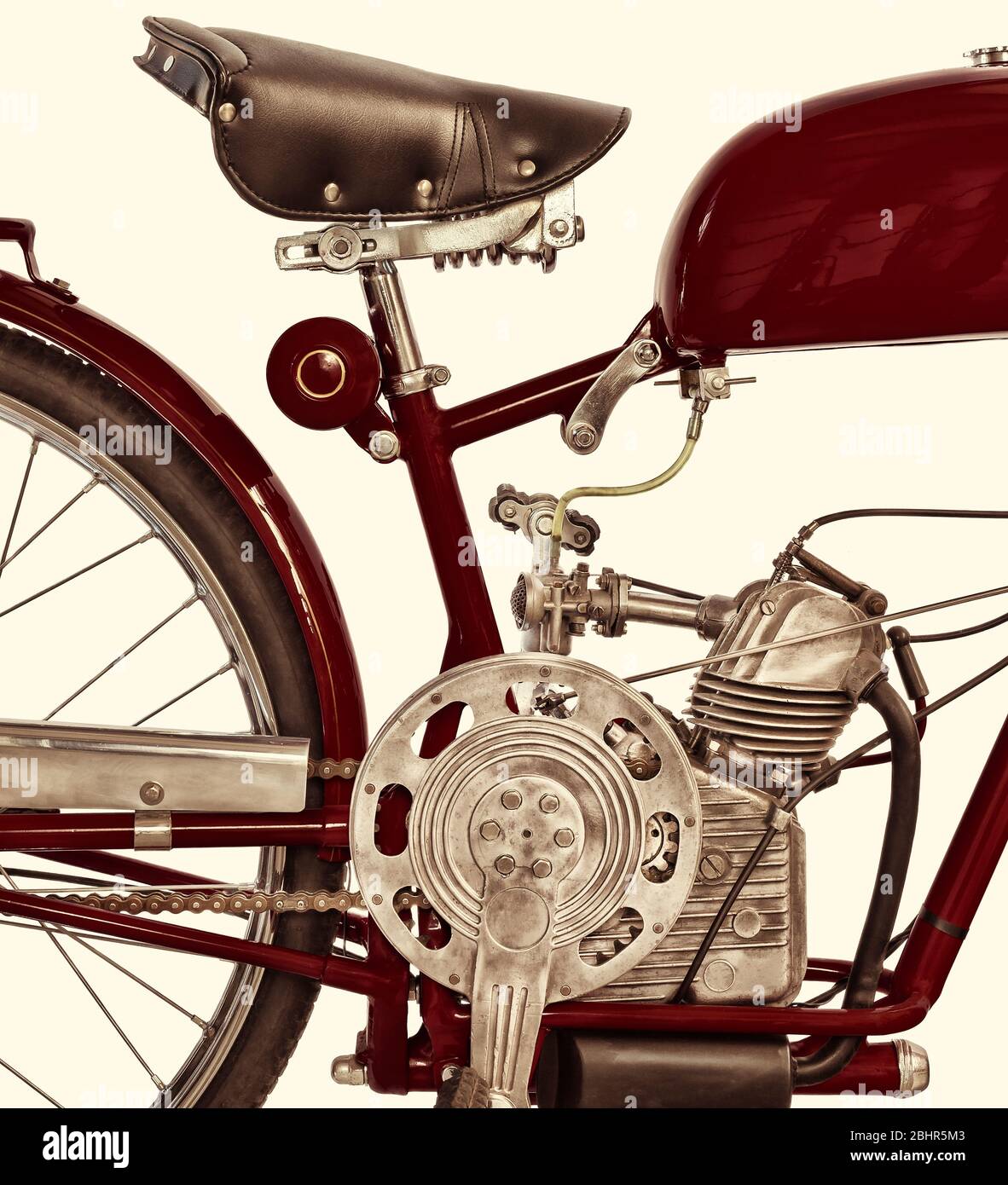 Retro styled side view of an ancient Italian red motorcycle Stock Photo