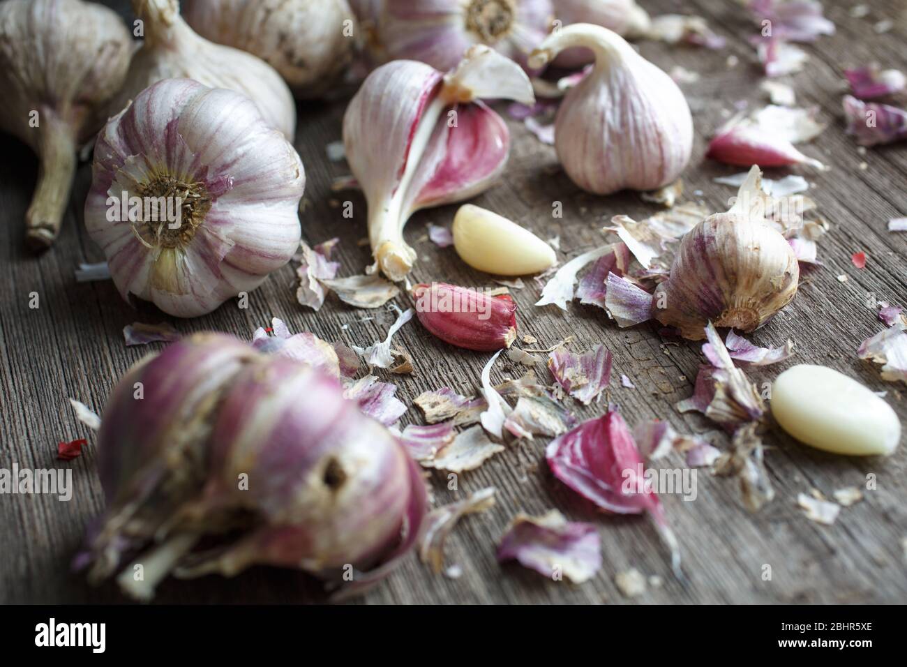 Garlic cloves on a vintage wooden background Stock Photo - Alamy