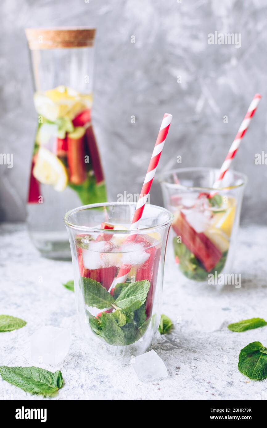 Summer refreshing drink with rhubarb, lemon and mint. Rhubarb lemonade. Pitcher with fresh cool spring fruit infused detox water. Health care, fitness Stock Photo