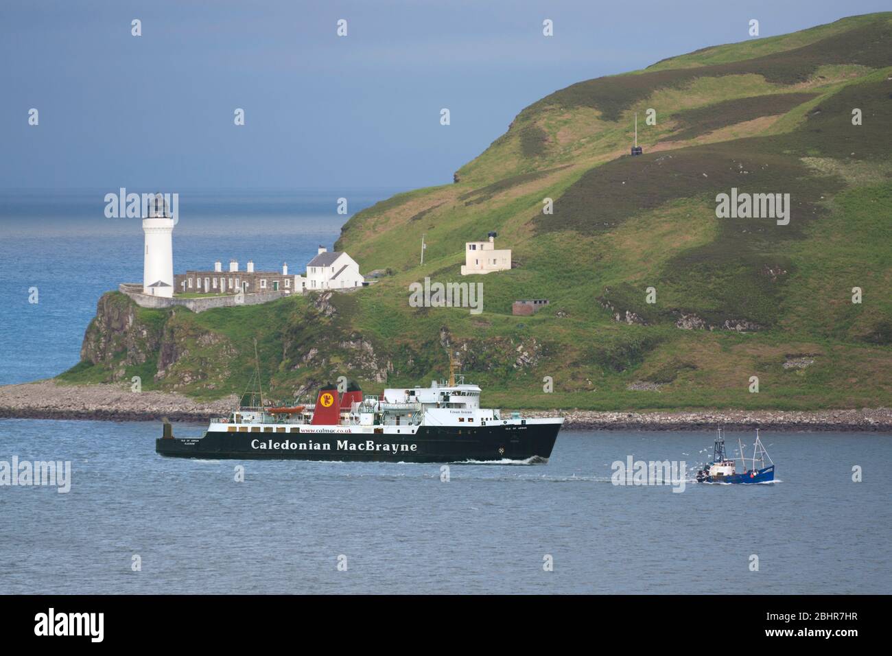 MV Isle of Arran passing Davaar Lighthouse. Stock Photo