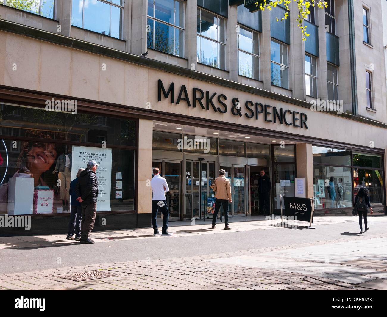 York, UK. 27th April 2020. People queueing at a two metre distance  outside Marks and Spencer in York. Credit: Ed Clews/Alamy Live News. Stock Photo