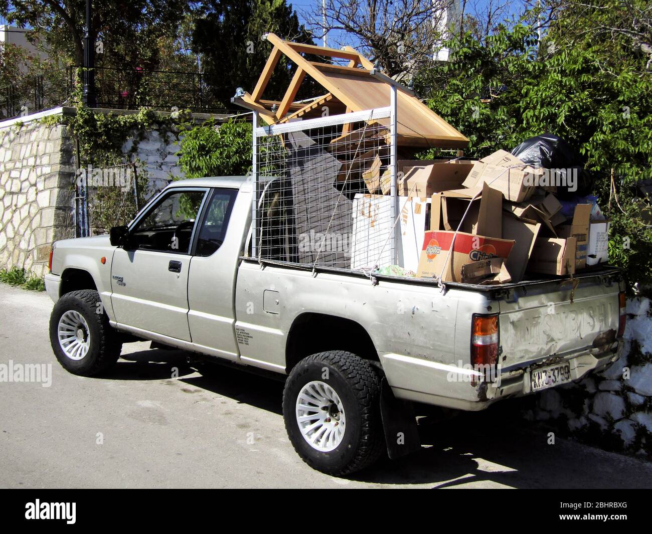 Fully loaded Pickup Truck with Rubbish, Galatas Village, Crete, Greece Stock Photo
