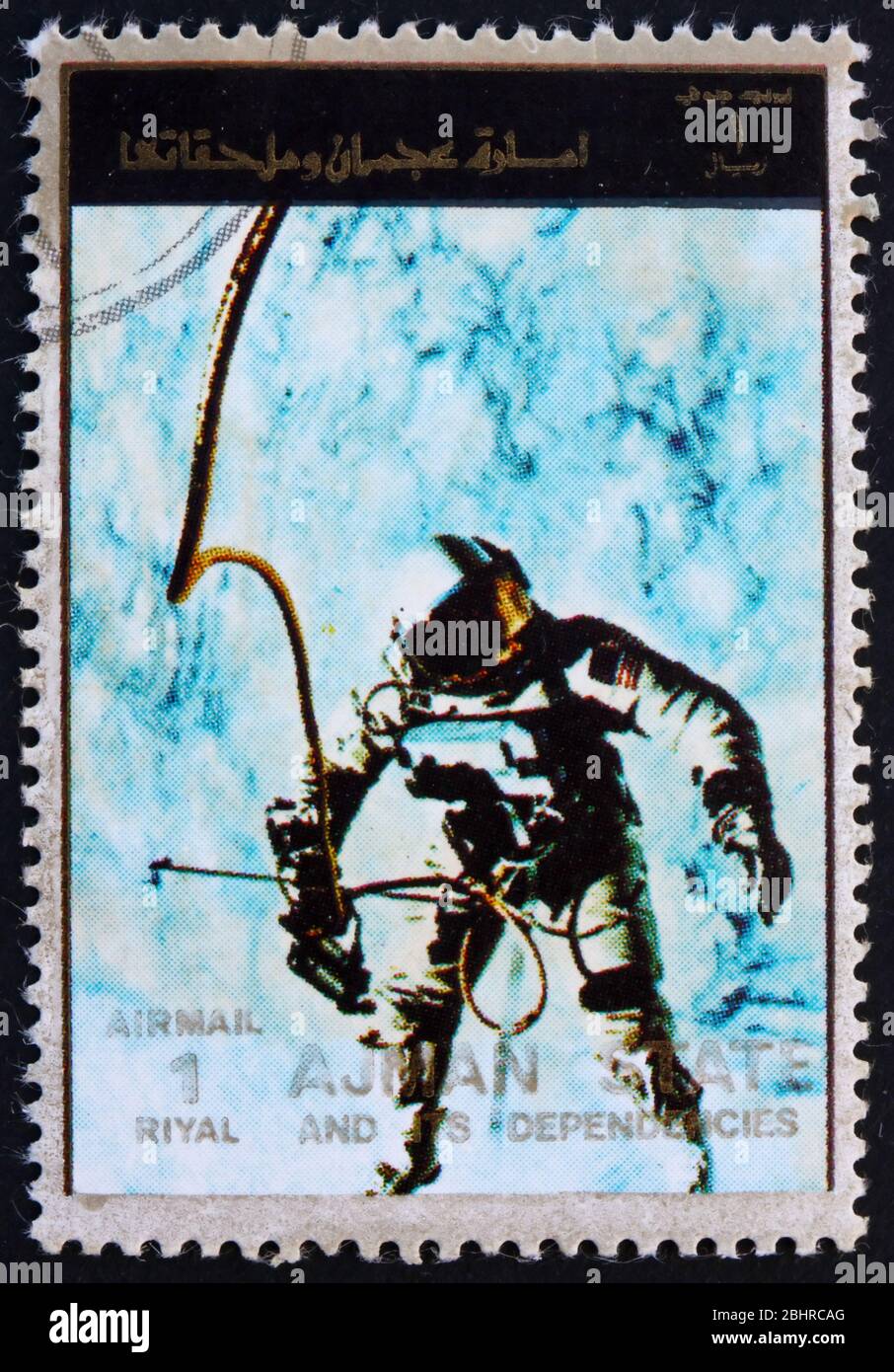 AJMAN - CIRCA 1973: a stamp printed in the Ajman shows Edward White during Spacewalk, Gemini 4, Spaceflight Program, circa 1973 Stock Photo