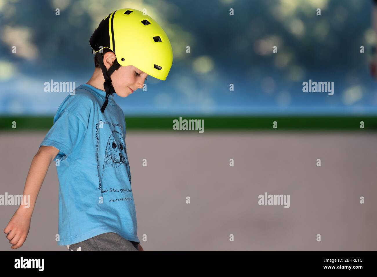Caucasian boy with yellow helmet. Safety concept image. Stock Photo
