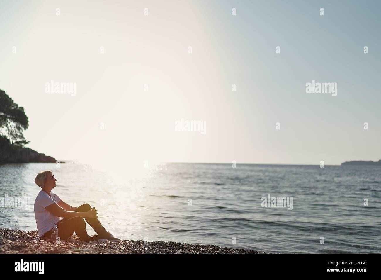 Mature woman relax sun beach hi-res stock photography and images - Alamy