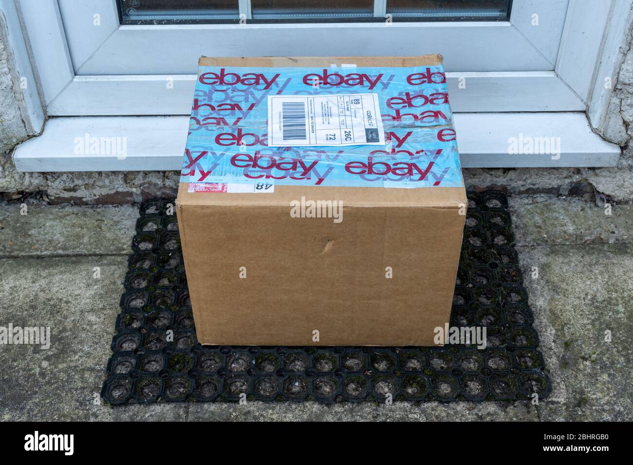 Ebay parcel, cardboard box, package, delivery, left on doorstep, UK Stock Photo