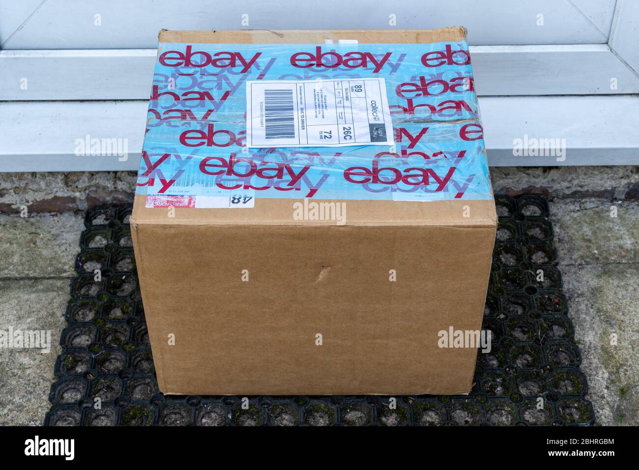 Ebay parcel, cardboard box, package, delivery, left on doorstep, UK Stock Photo