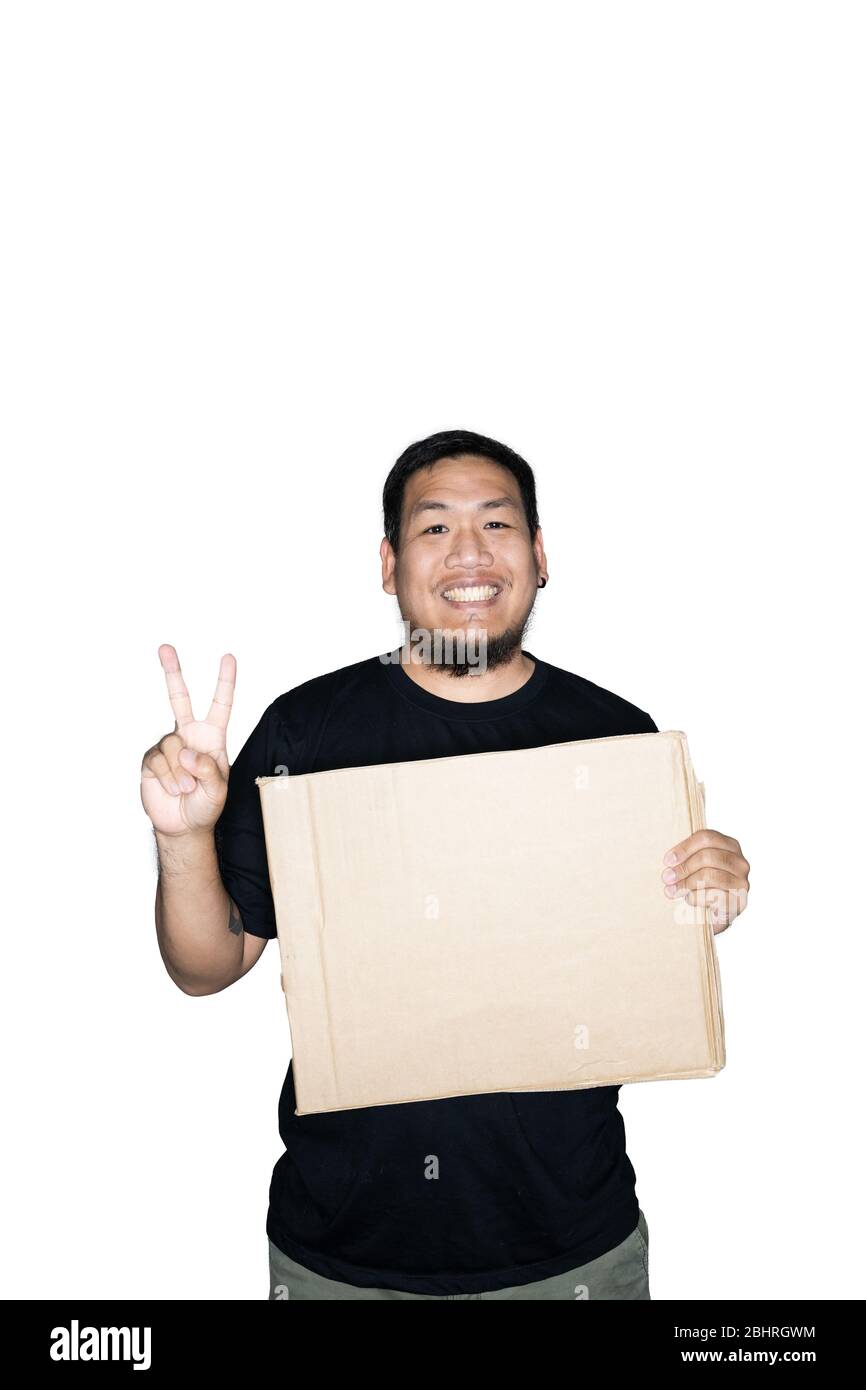 Bearded asian men worker dressed in black tees is holding cardboard and ...