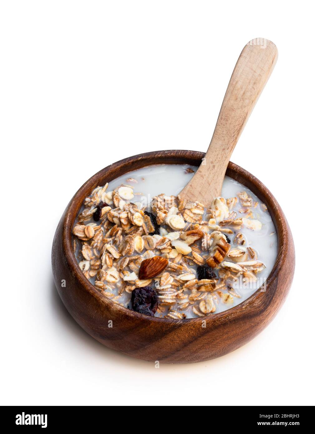 Healthy breakfast muesli and granola with skimmed milk in clear glass