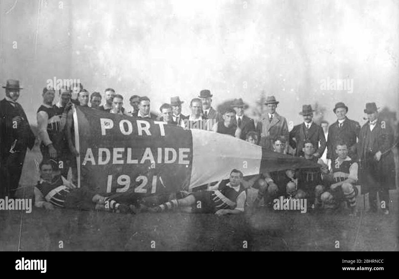 Left Port Adelaide Players With The 1921 Safl Premiership Flag Pennant Presented To Them During Half Time Of The Opening Match Of The 1922 Safl Season At Adelaide Oval 32 Right Cartoon From