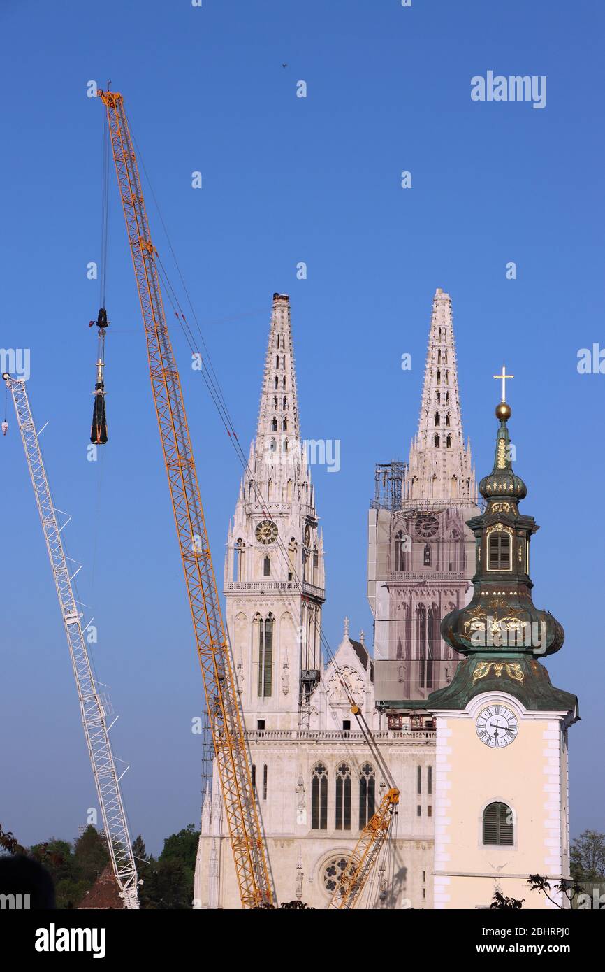 Removal part of the left tower of Zagreb Cathedral, damaged in the earthquake of March 22. 2020. The right tower itself collapsed. Stock Photo