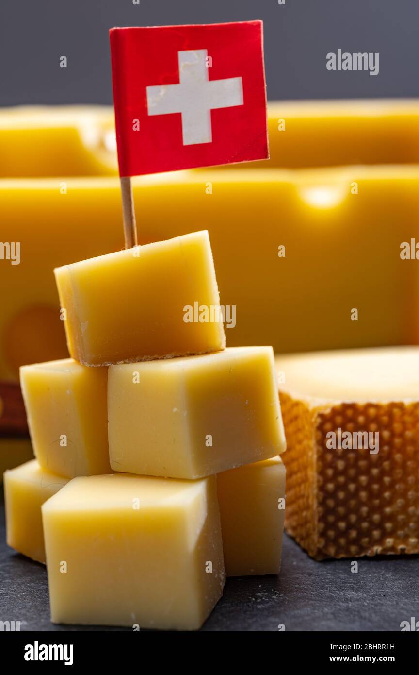 Swiss cheeses, block of mediumhard yellow cheese emmental or