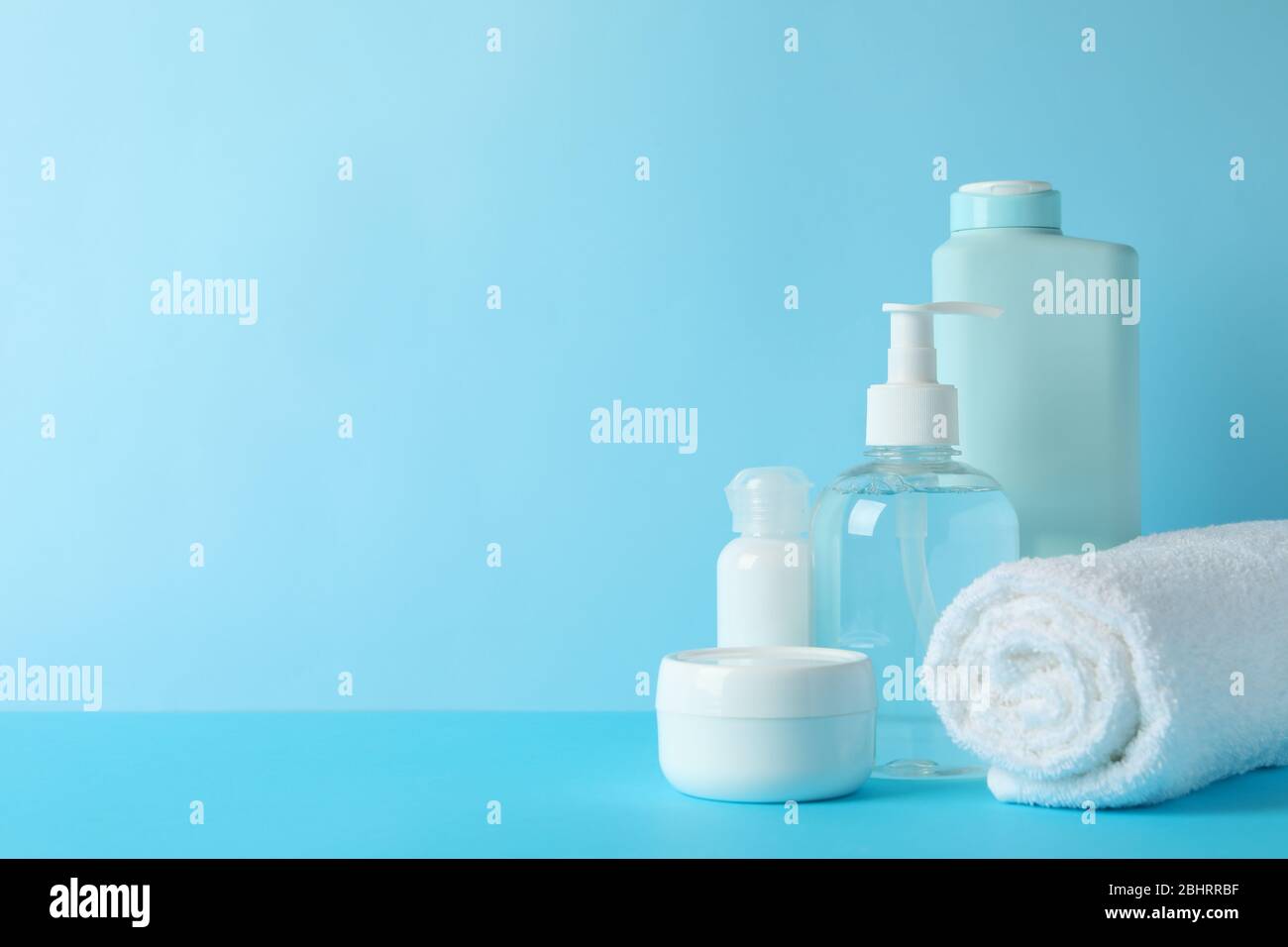 Body care products on blue background. Personal hygiene Stock Photo Alamy