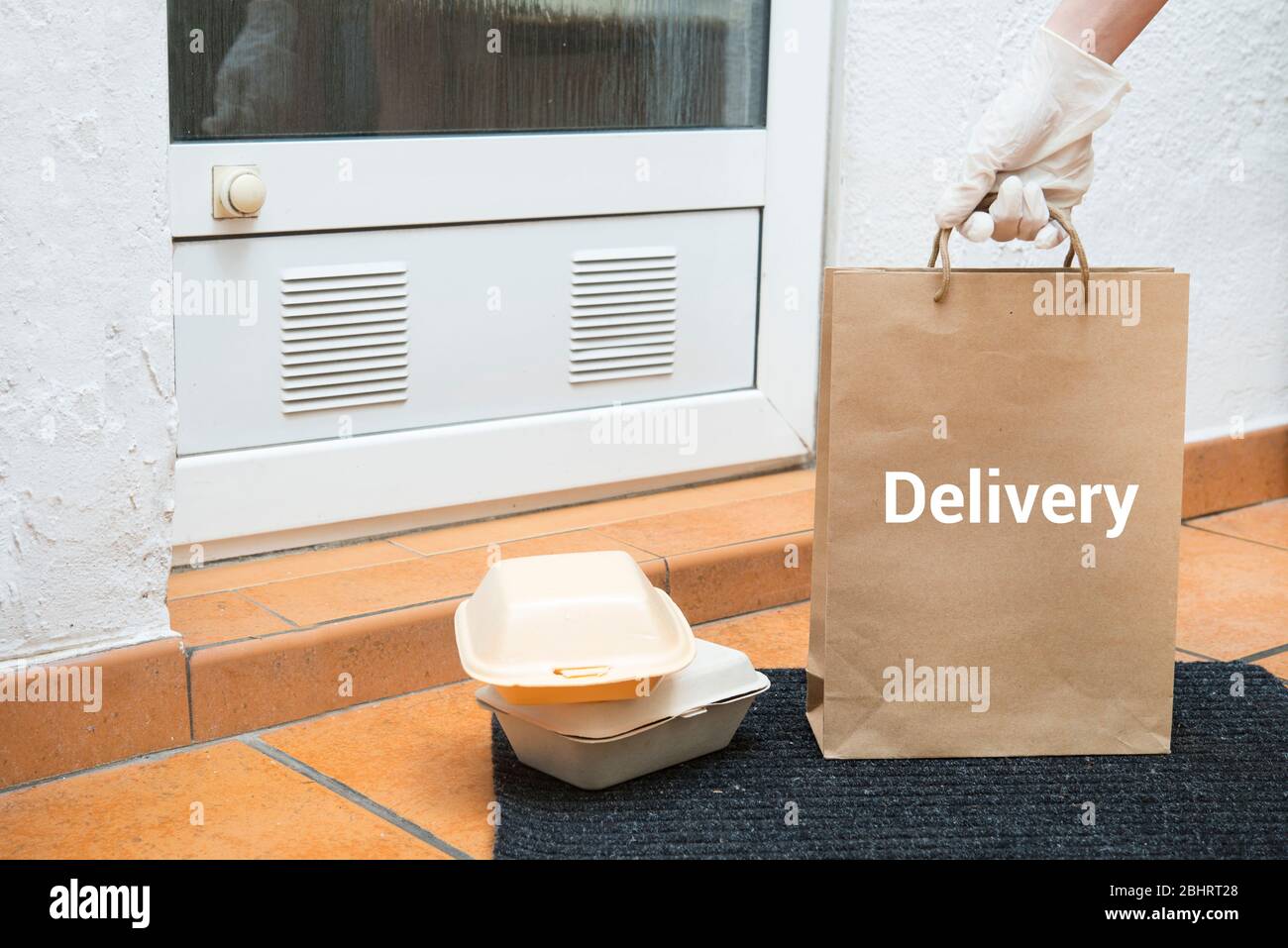 home delivery service, boxes standing by the house doors Stock Photo ...