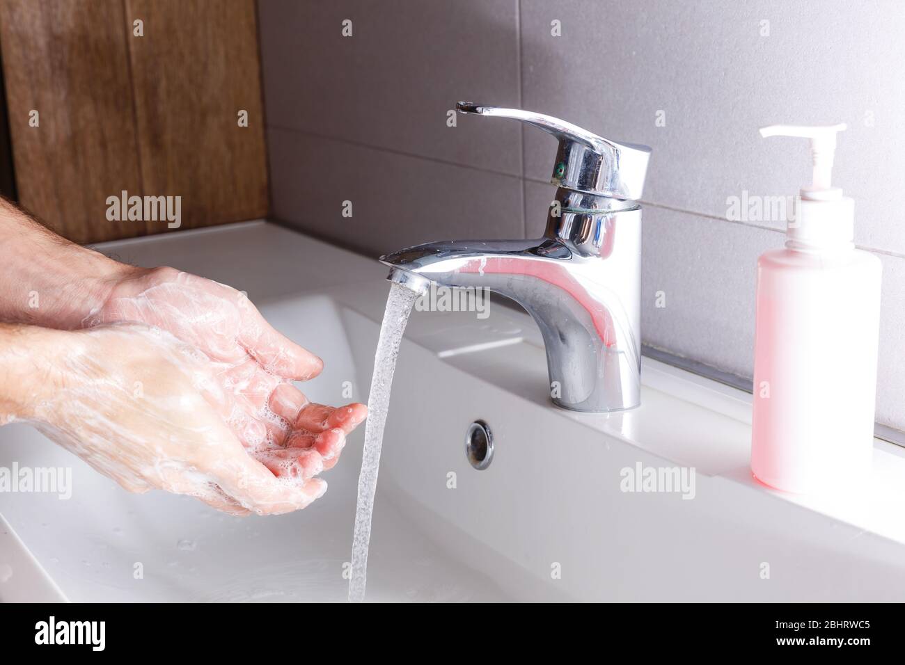 man washing hands isolated over white background Stock Photo Alamy