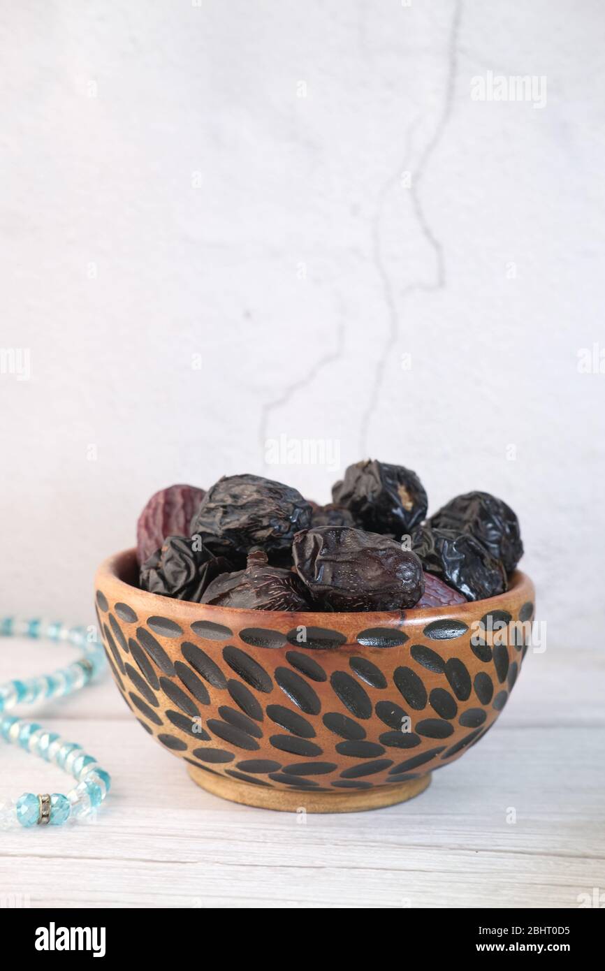 the concept of ramadan, close up of date fruit in a bowl Stock Photo