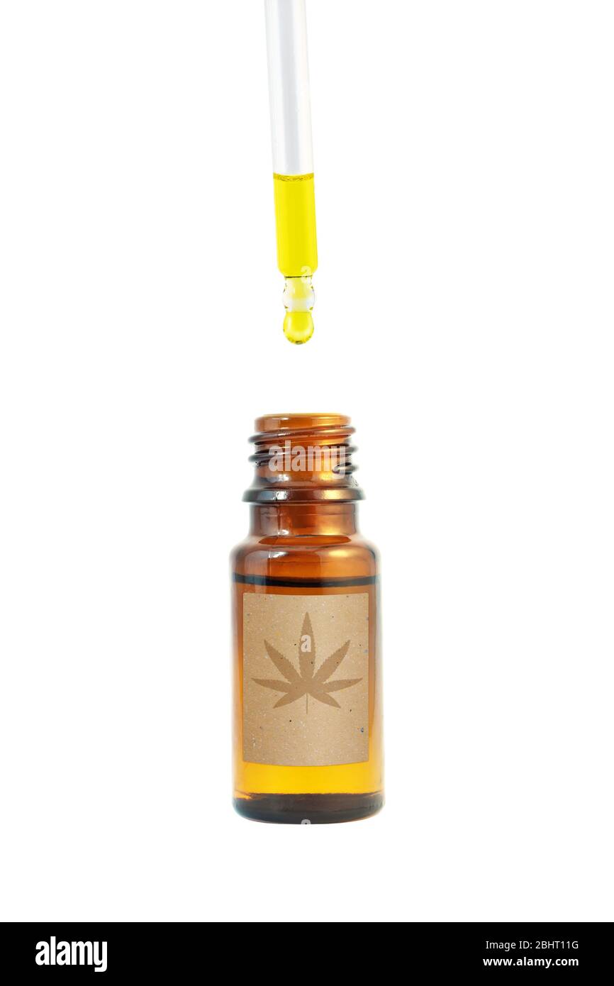 Cannabidiol oil in the dark amber glass bottle and dropper isolated on white. Сannabis leaf silhouette on the paper label. Stock Photo