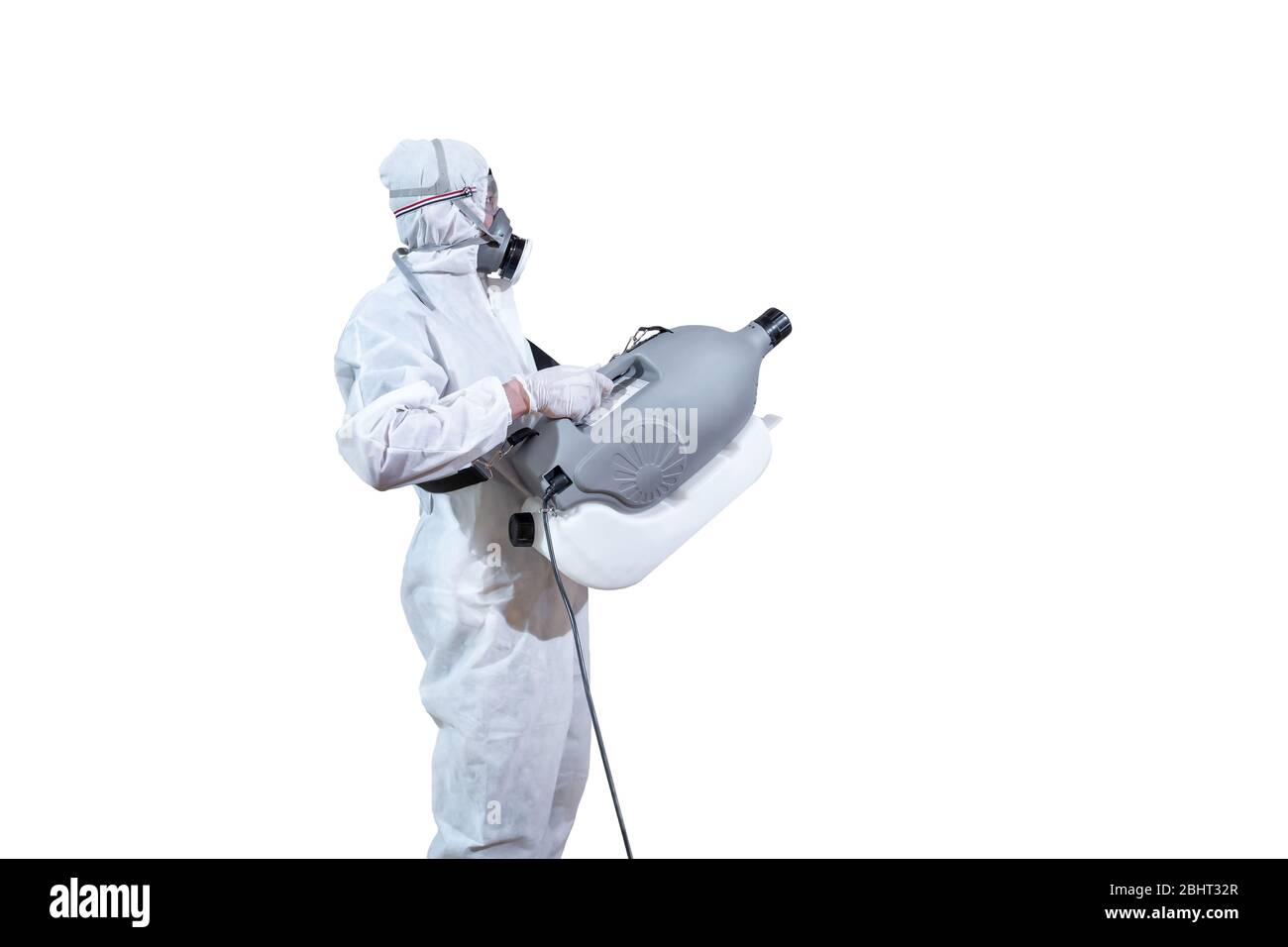 Specific specialist and professional in virus protection suit holds machine to spray sanitizer liquid solution to kill Coronavirus (COVID-19) isolated Stock Photo