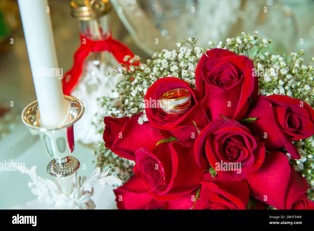 Red ribbon . Red engagement flowers on white table . Bride and groom with  Engagement gold rings put on the red wedding bouquet . Red engagement Stock  Photo - Alamy, image size:1300x956