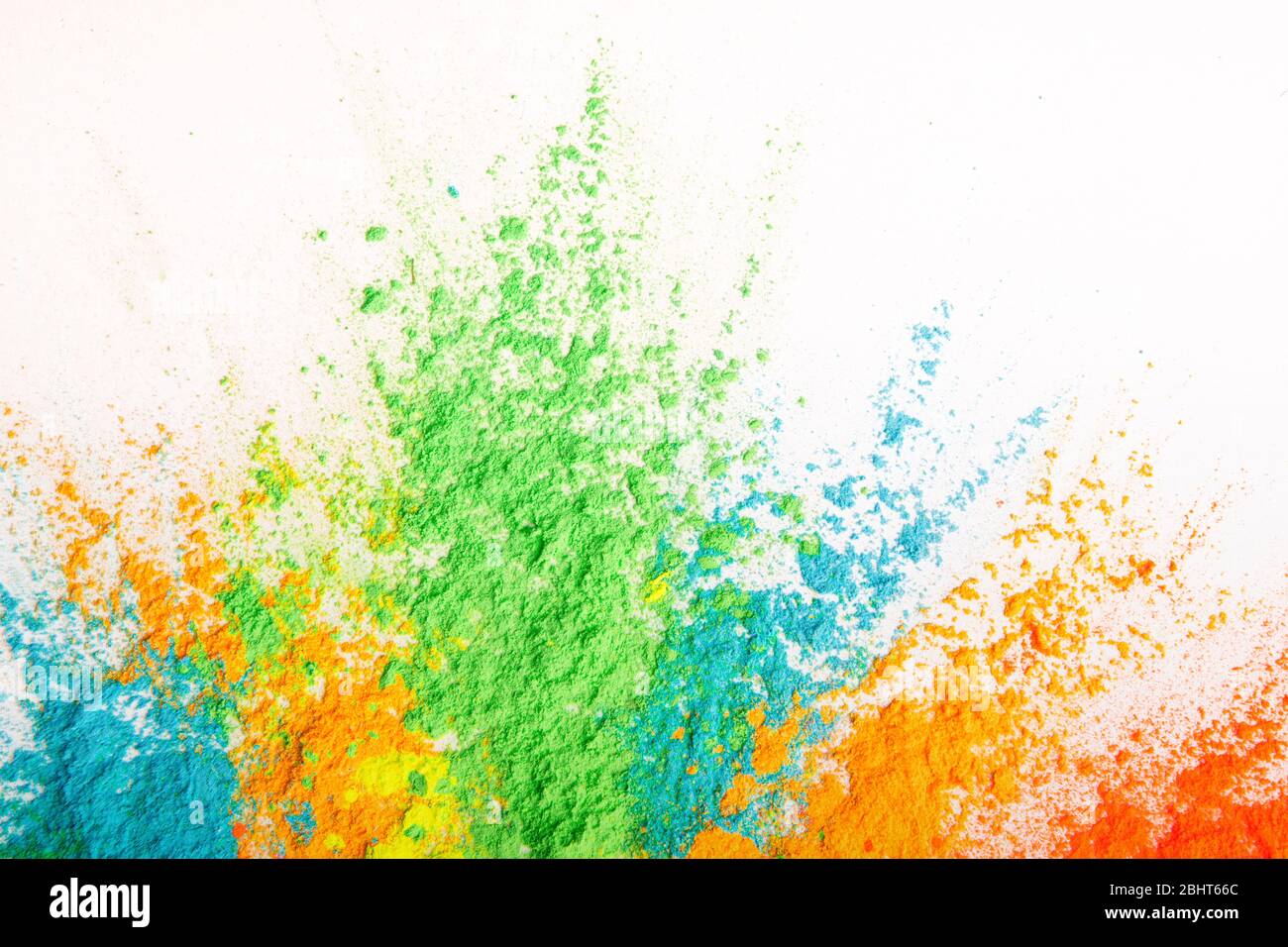 Colorful powder explosion. Abstract bright color dust particles Stock Photo