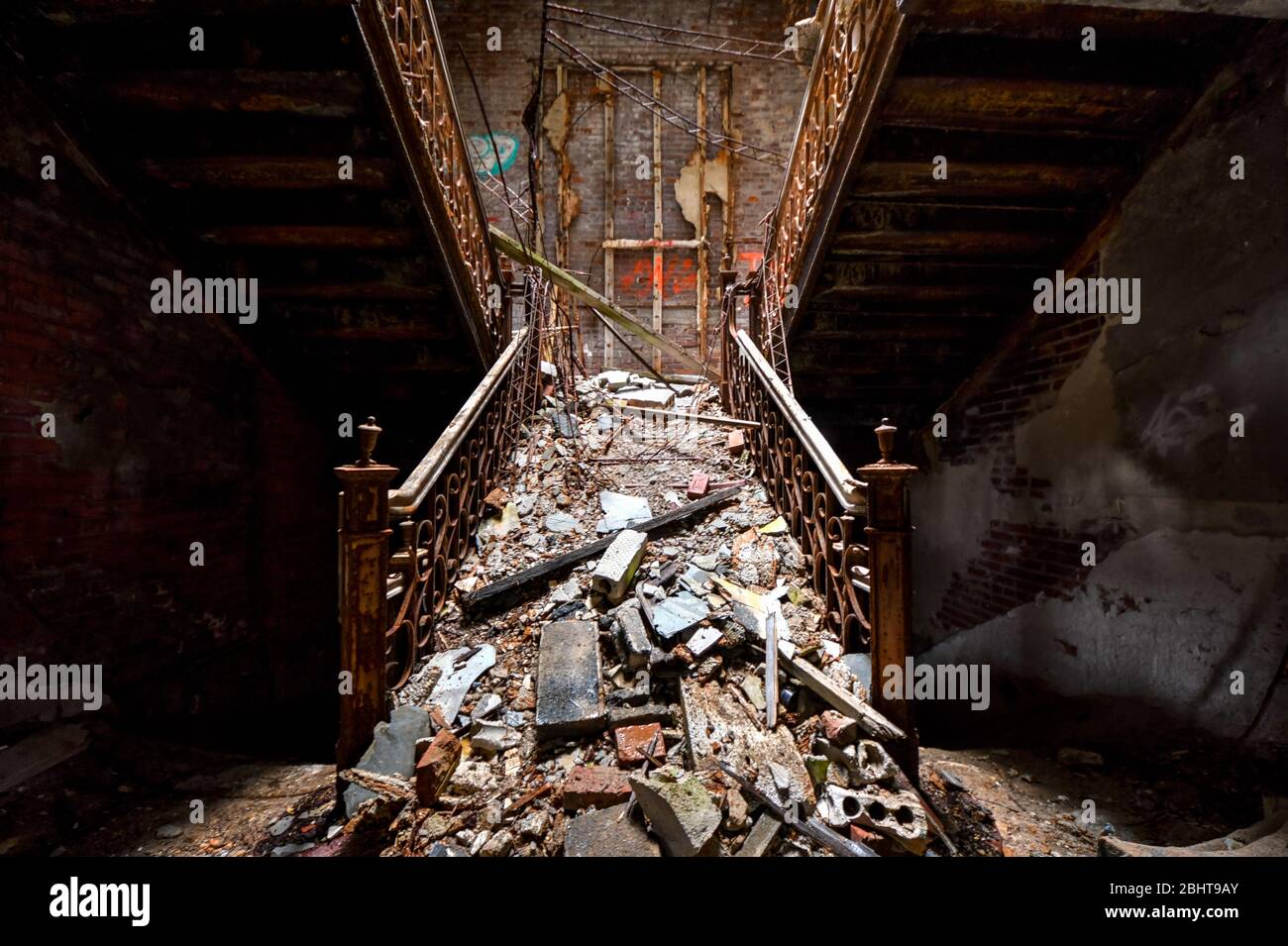 Staircase with rubble on it in an abandoned hospital Stock Photo