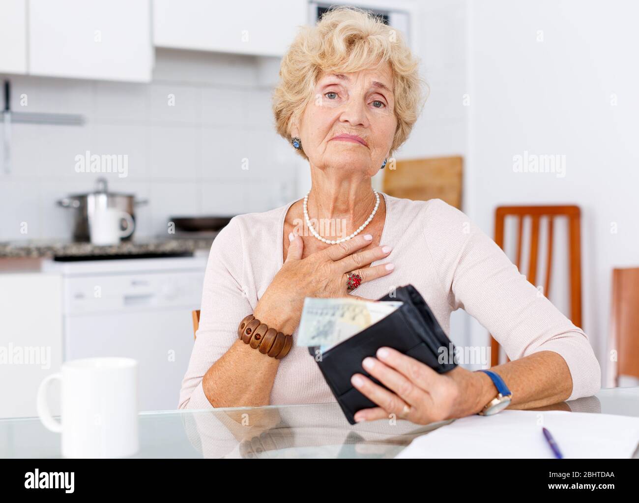 Frustrated mature woman holding hi-res stock photography and images - Alamy