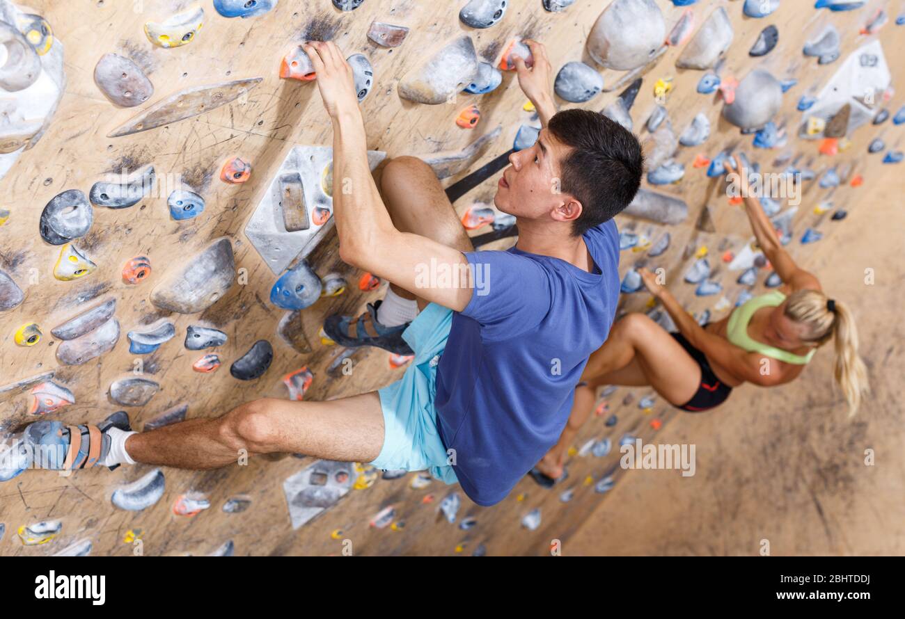 Rock climbing by professional mountaineers hires stock photography and