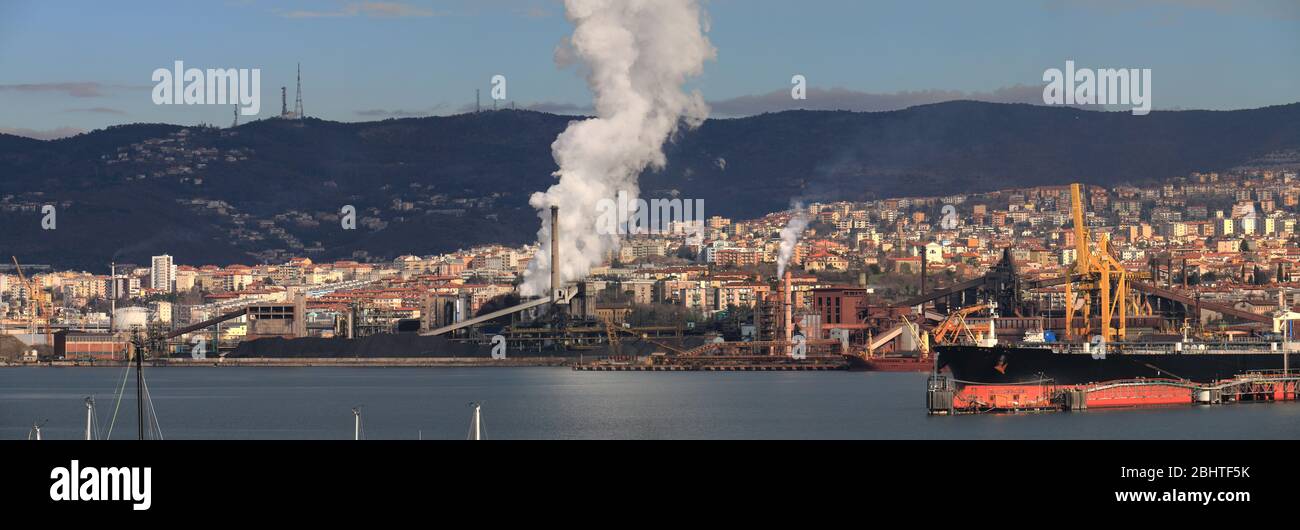 Industrial zone Trieste with white smoke in background, Trieste, Italy, Europe Stock Photo