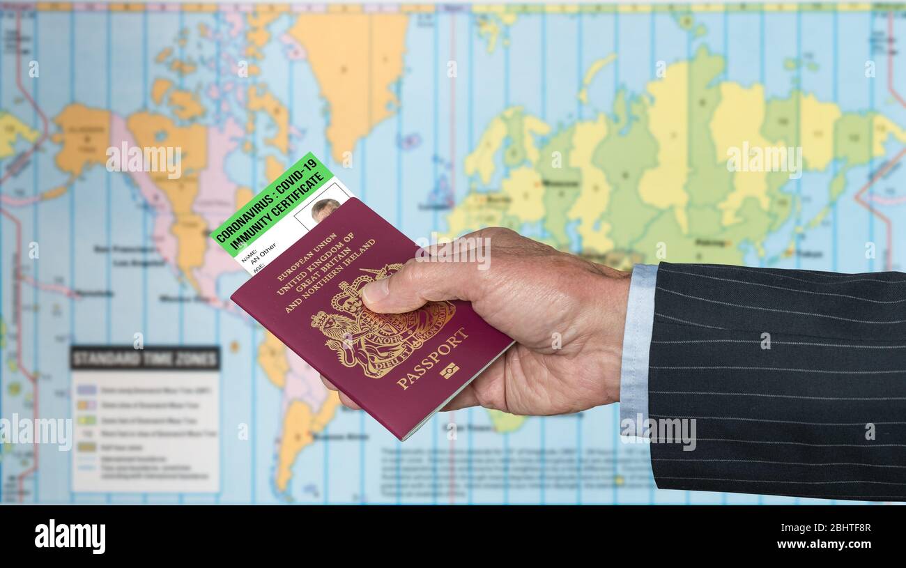 Senior man arm in suit and hand holding a USA passport with a coronavirus immunity certificate against global map Stock Photo