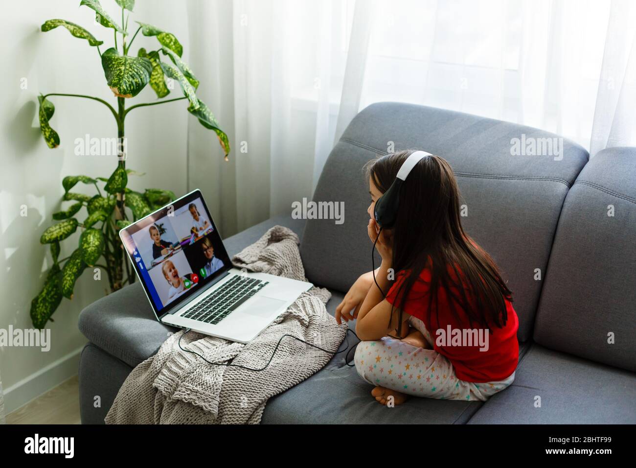 little girl studying with computer Stock Photo - Alamy